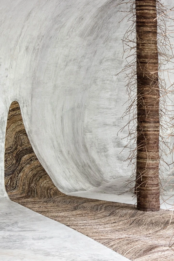 Designed to connect its visitors with nature, guests are invited to wander barefoot across the IK Lab's winding, polished cement floors