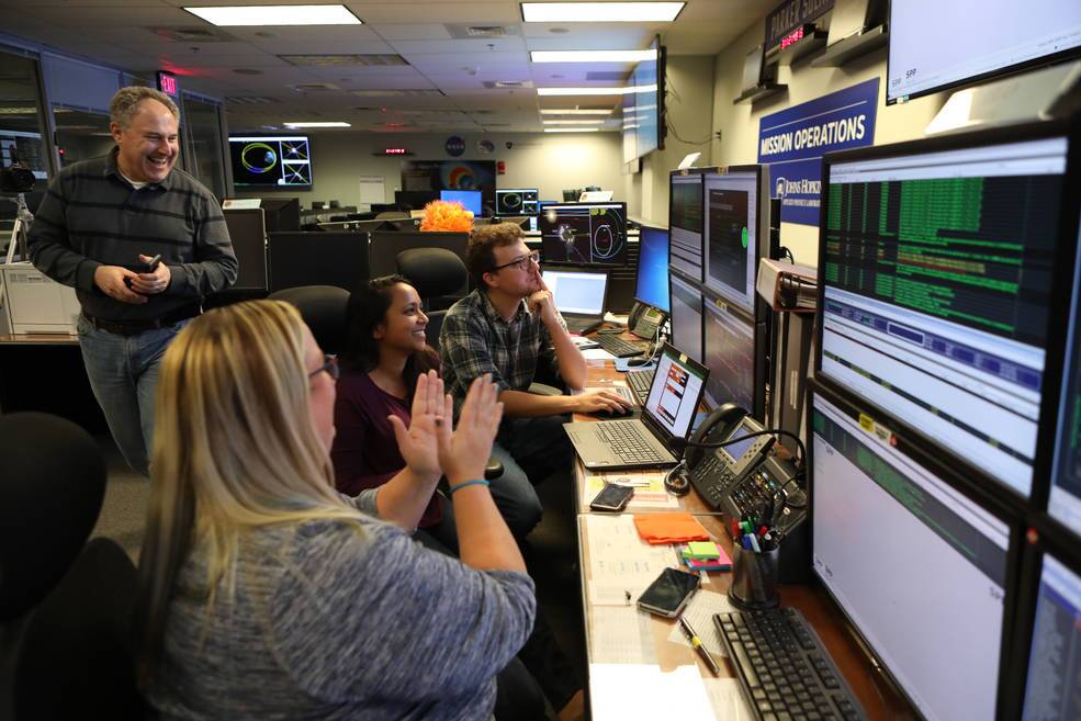 Members of the Parker Solar Probe mission team celebrate on Novmber 7, 2018, after receiving a beacon indicating the spacecraft is in good health following its first perihelion