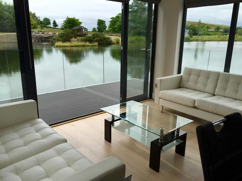 The interior includes a living room, dining room, and kitchen
