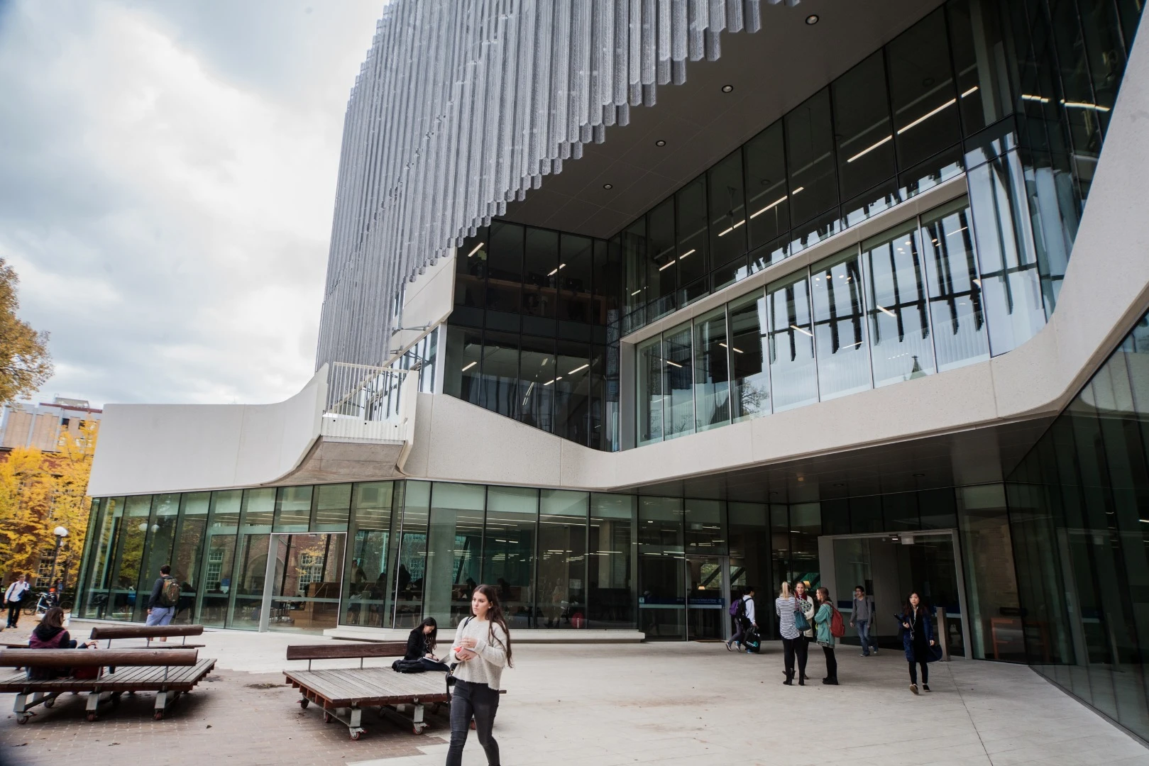Perforated zinc sunshades shield the north, east and west sides of the building, resting a foot or so out from the building's exterior