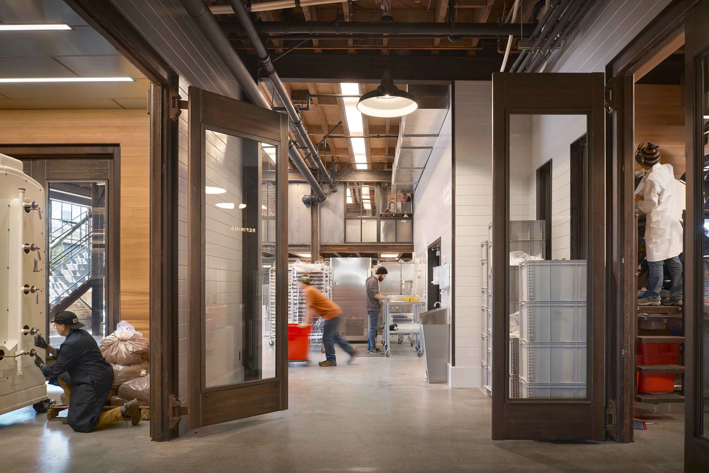 Dandelion Chocolate Factory's newly-designed store includes brush-painted wood siding, handmade tiles, and redwood millwork in an attempt to echo the spirit of a manufacturing space