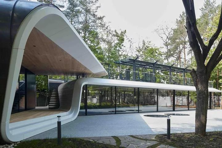 A forest-set garage transforms car storage into a gallery-like architectural space