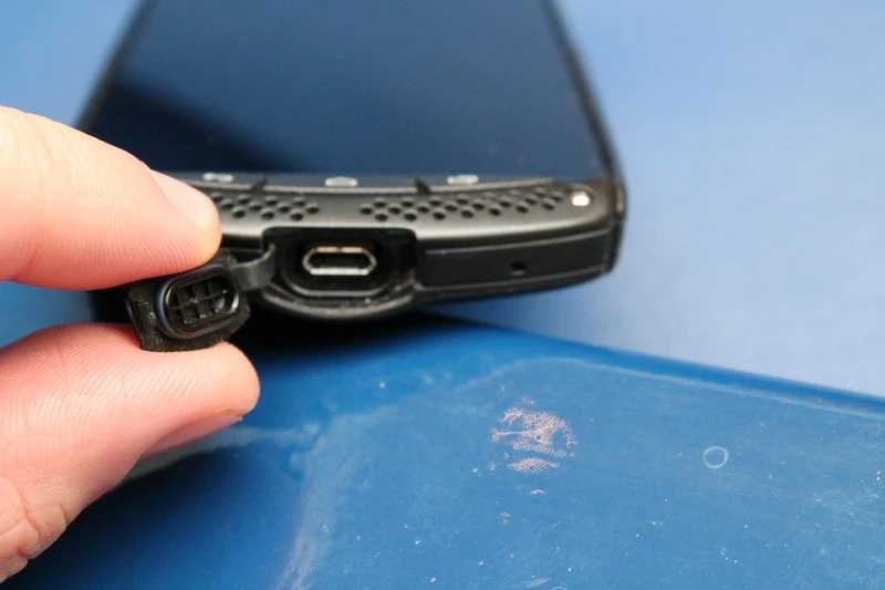 The bottom USB port gets a waterproof cover