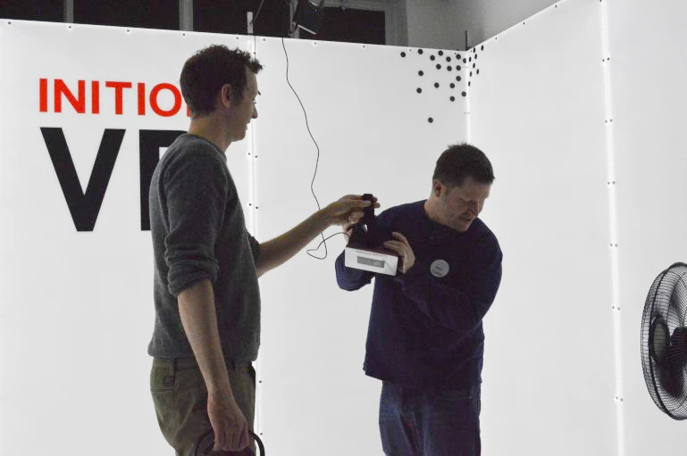 Inition's Andy Millns helps me on with the Oculus Rift (Photo: Gizmag)