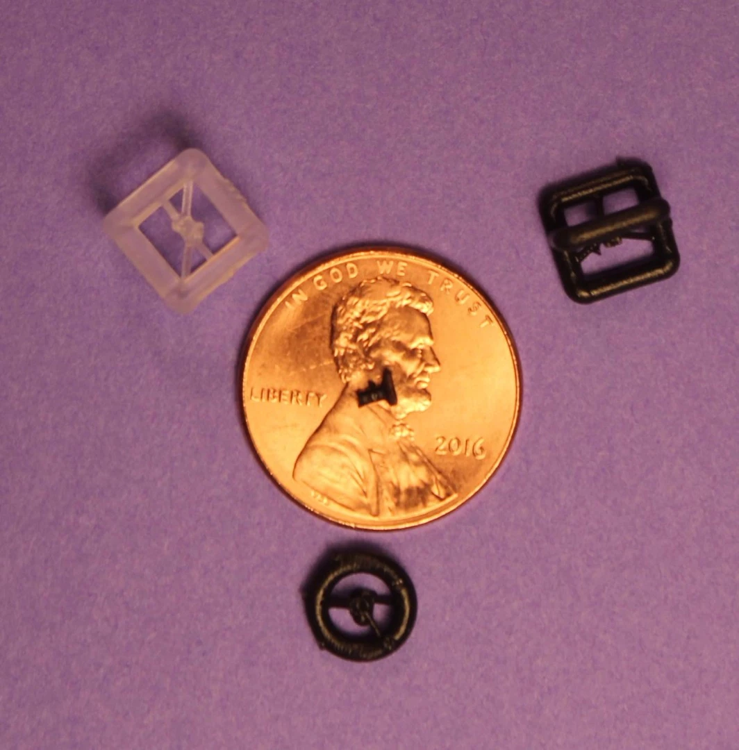 One of the 3D-printed prostheses, placed on a penny for scale