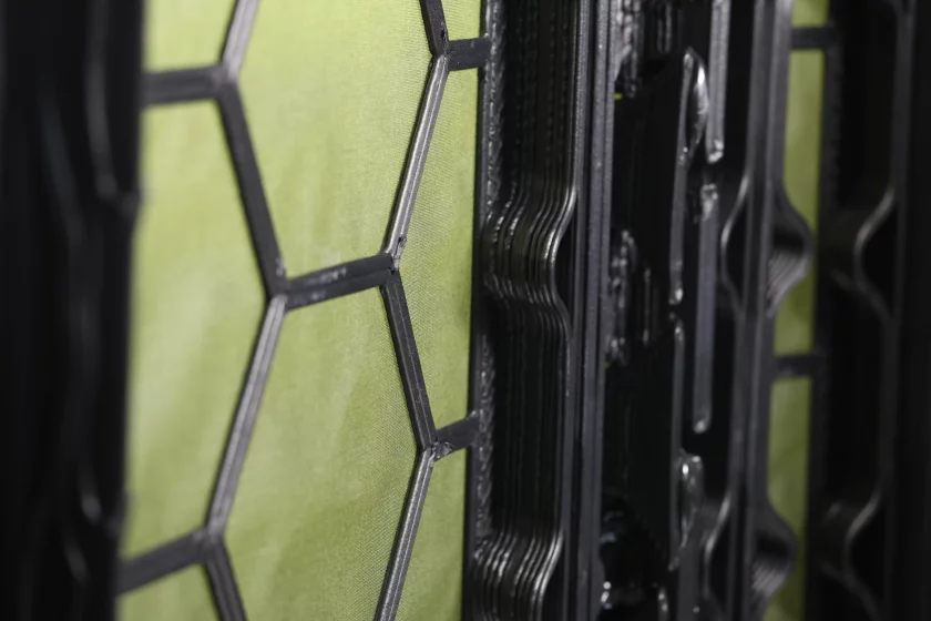 Each panel consists of the fabric base (green) and the 3D-printed structural grid (black)