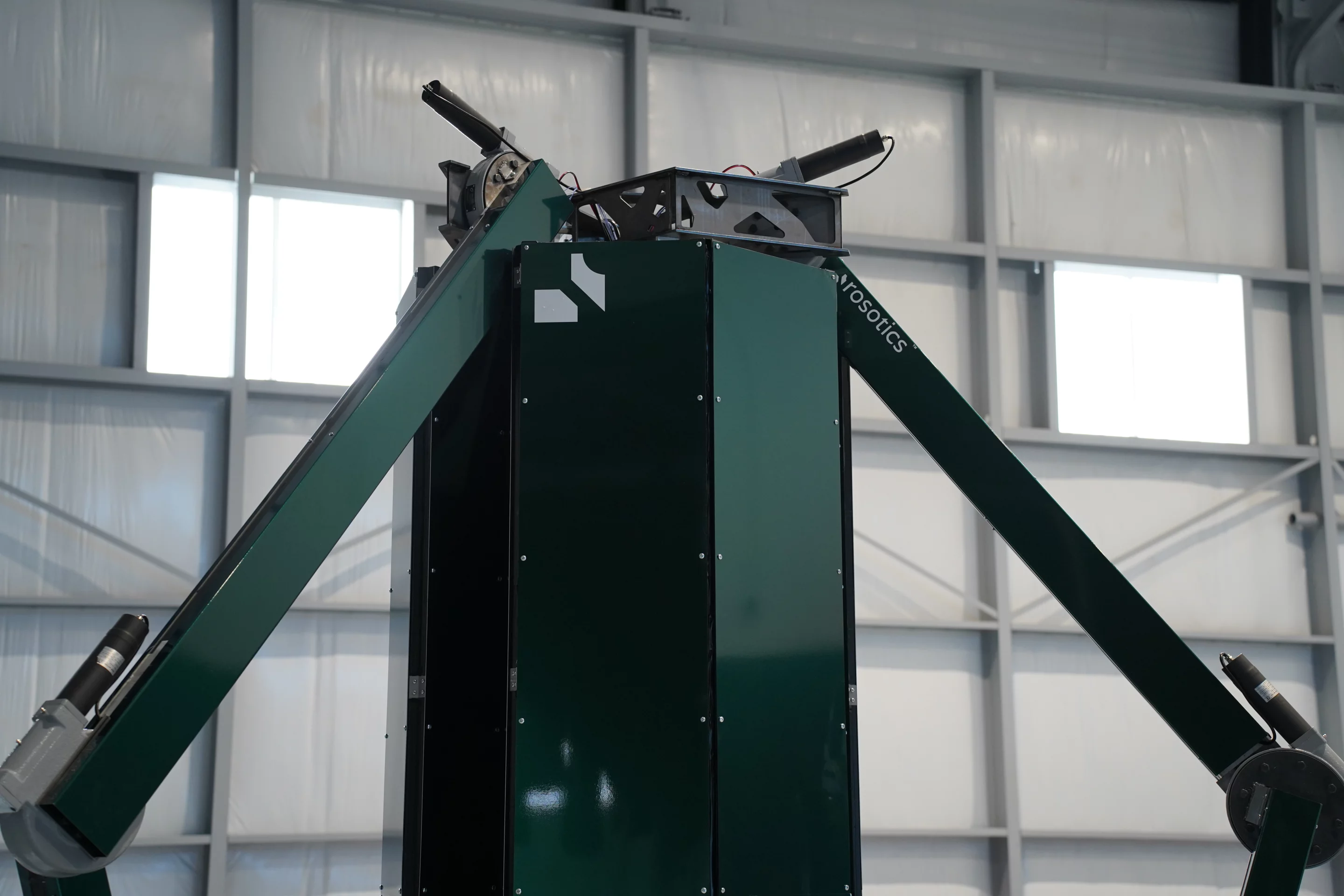 Large arms move the print heads