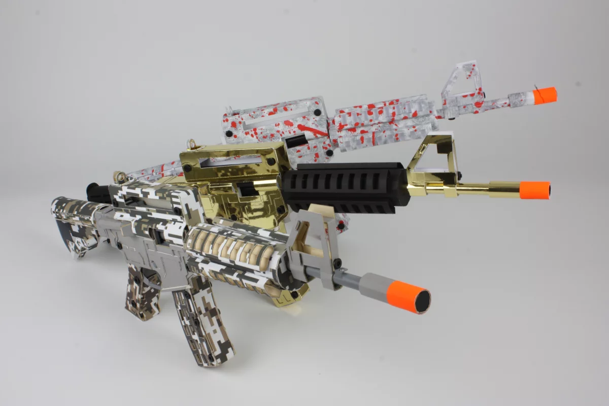 The cardboard rifles are available in three iterations: “Digital Ops,” “Zombie Slayer,” and “Golden Touch”
