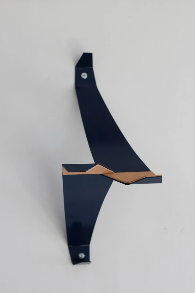 The Bike Valet is a bicycle wall storage device that uses a cantilevered design to hold bikes in place