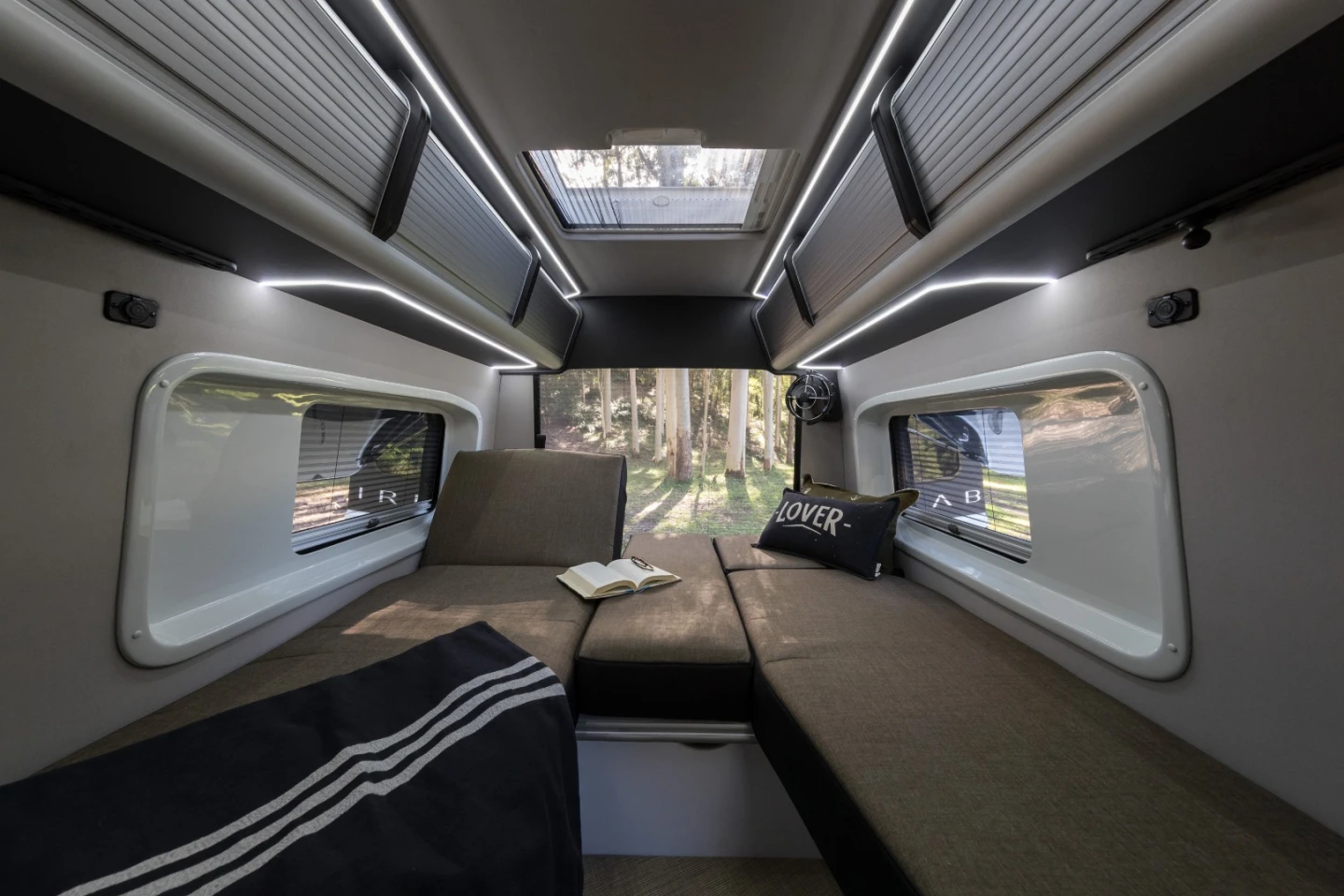 Each of the split rear beds adjusts into a chaise lounge for sitting and relaxing at camp