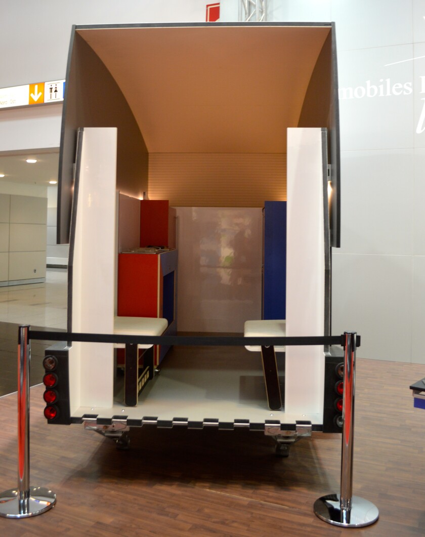 The lifted upper deck of the Vohringer Speed-Wagon supports a sleeping platform