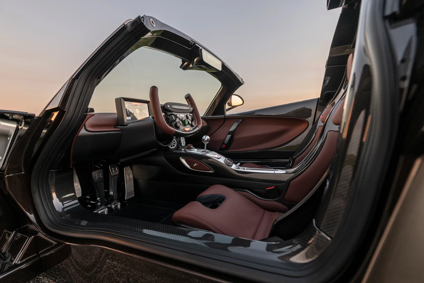 Inside, the switchgear has been reengineered with horological precision, from luminous-infill toggles that capture daylight and glow softly at night to a parking brake lever that feels like a bolt-action rifle