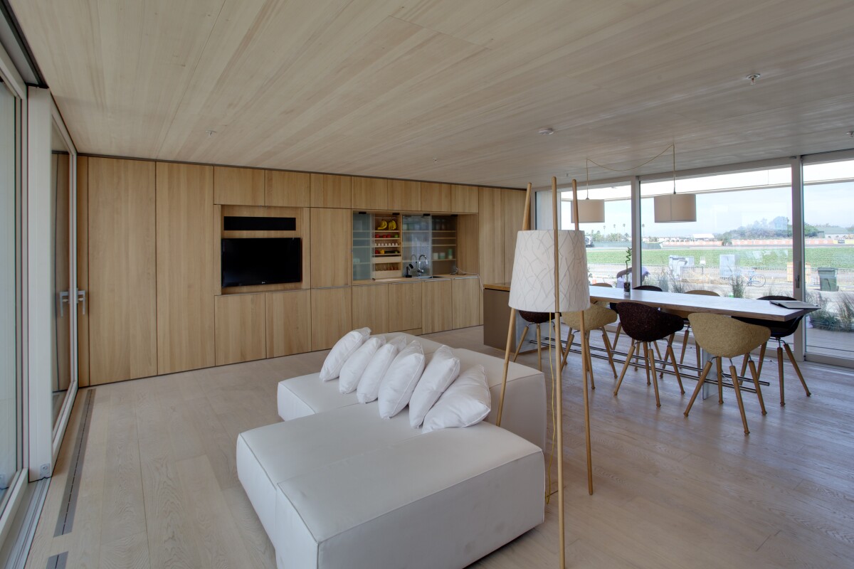 The interior of the LISI house leaves mostly open floor area. Several types of wood were used in the construction (Photo: Jason Flakes (Nomoi)/U.S. Department of Energy)