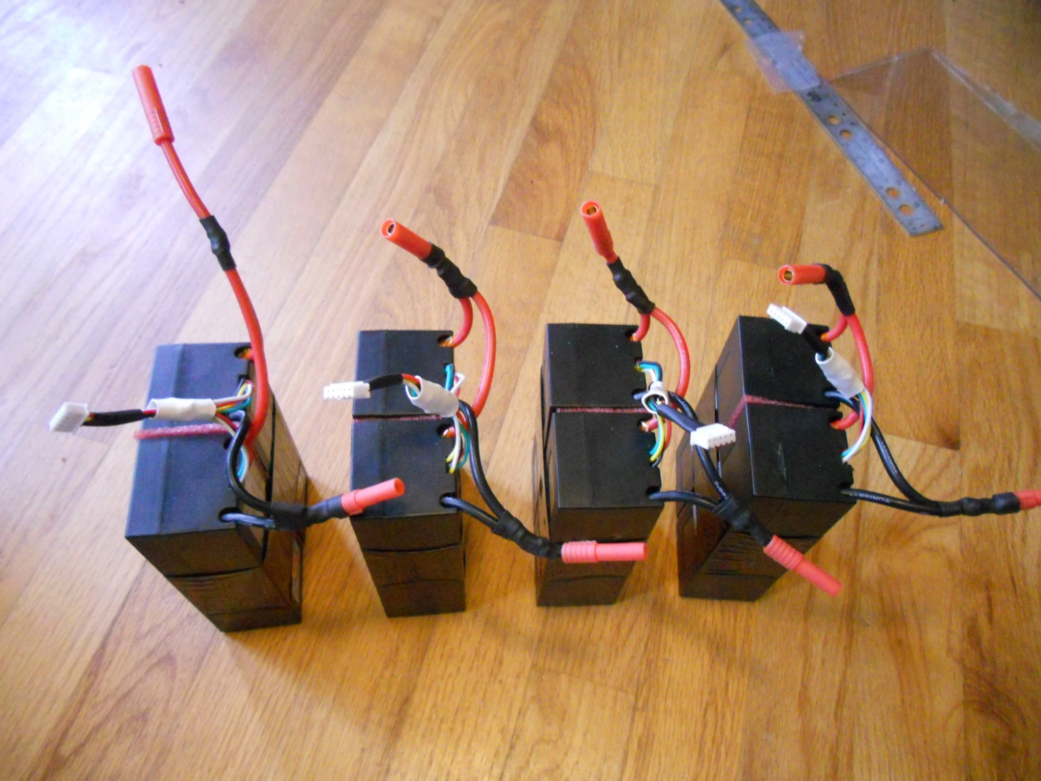 The eight Turnigy 5000 mAh 4s Li-Pol battery packs that will power the motor
