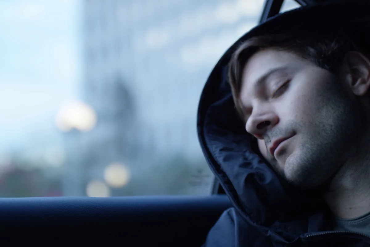 The pillow is formed by an ergonomically designed inflatable unit housed in the hood of the hoodie