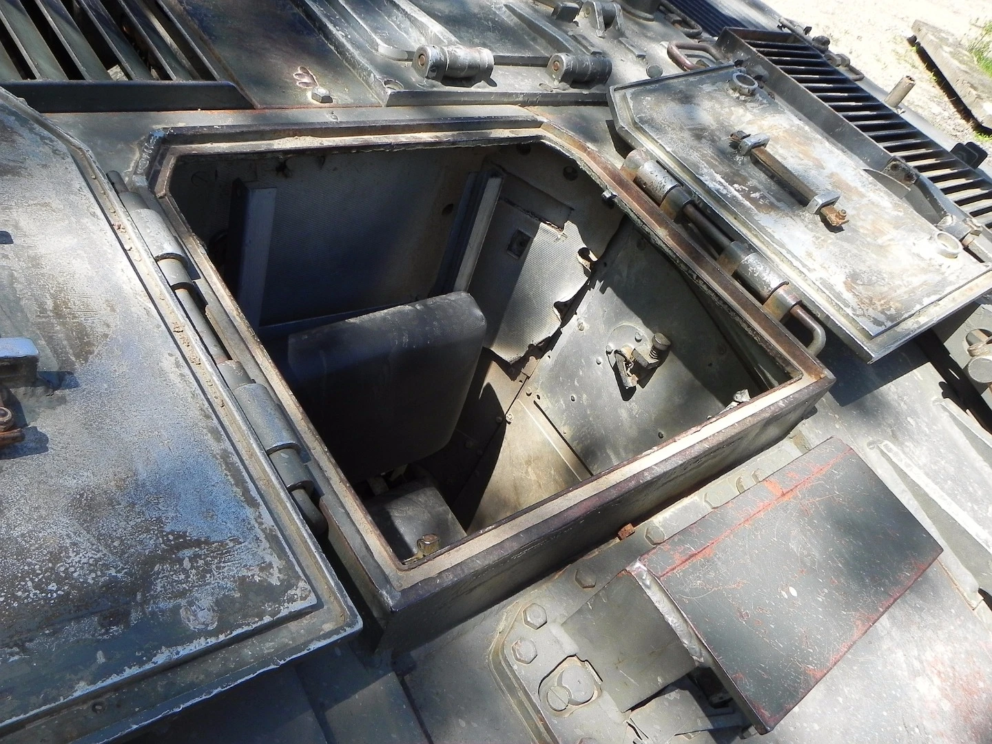 Ahead of the driver are two sticks for controlling the brakes on the Abbot FV433 and a throttle on the floor