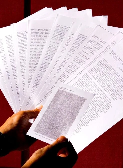 With text written only 1/100th of an inch high, 26 pages of 10-point text can be squeezed onto a 5 by 8-inch card. Xerox scientists developed the new MicroText Specialty Imaging Font so that important documents can be customized with super-small words and
