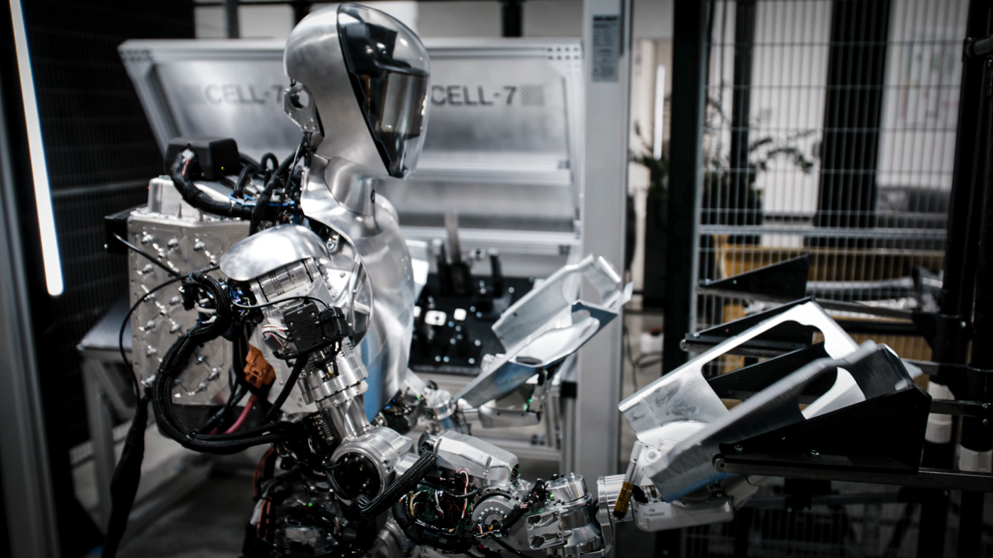 The Figure 01 handling car parts in preparation for its first real-world gig at BMW