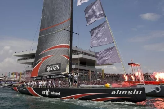 Alinghi passes by the America's Cup as it makes its way to the Race Course.