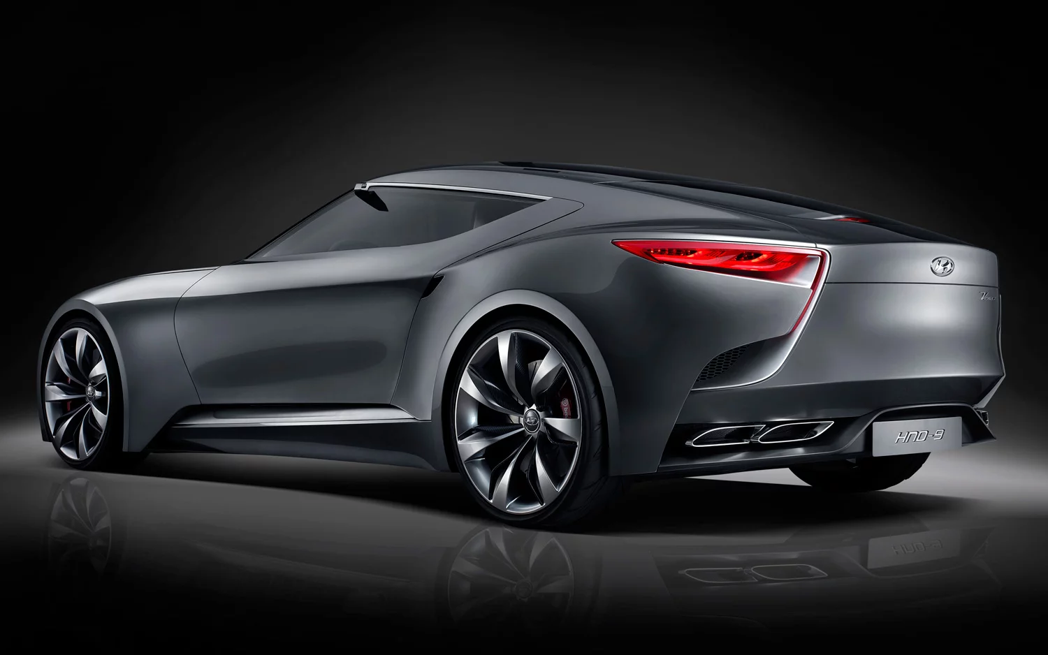 Sculpturally designed rear combination lamps strategically located between an assertive, long-raked hatch