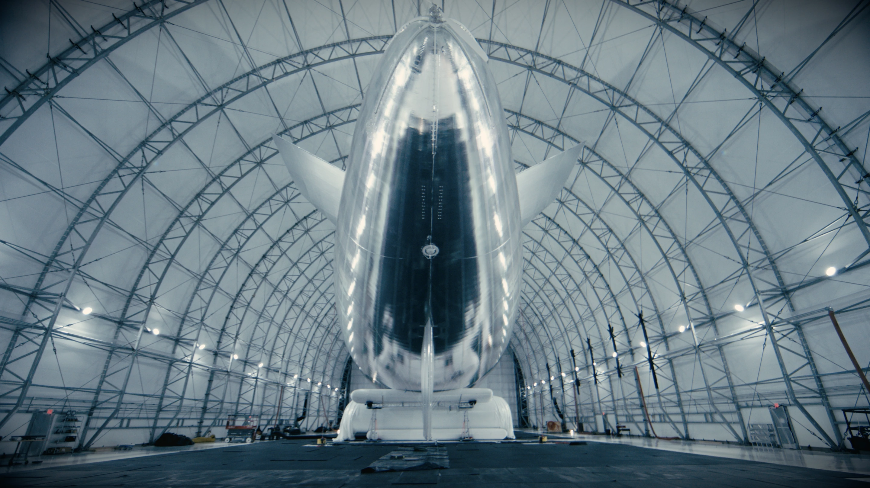 The aircraft's electric motors are powered by solar cells which are integrated into its full-body silver-foil "solar cape"