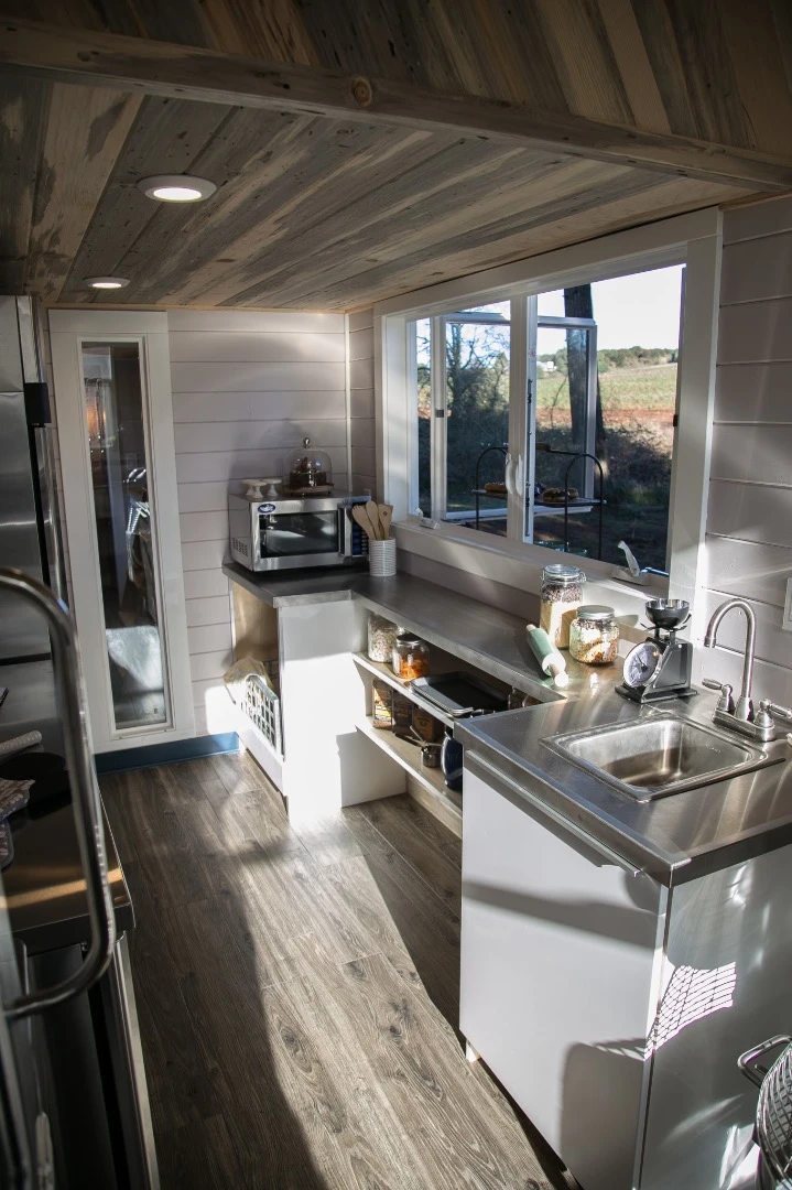 The Kentucky Donut Shop's kitchen features stainless steel countertop and backsplash