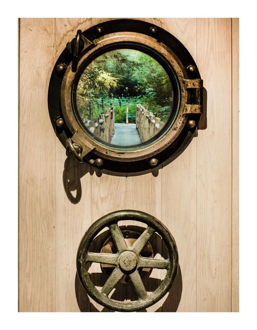 The door to the Woodsman's Treehouse features a real marine porthole and submarine locking mechanism