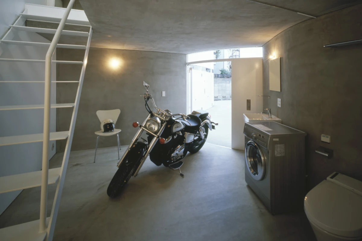 Bathrooms often double up with the garages at ground level, which saves space by elimintating the need to run pipes vertically through the apartment, but does mean residents will share quality getting-to-know-you time with their choppers