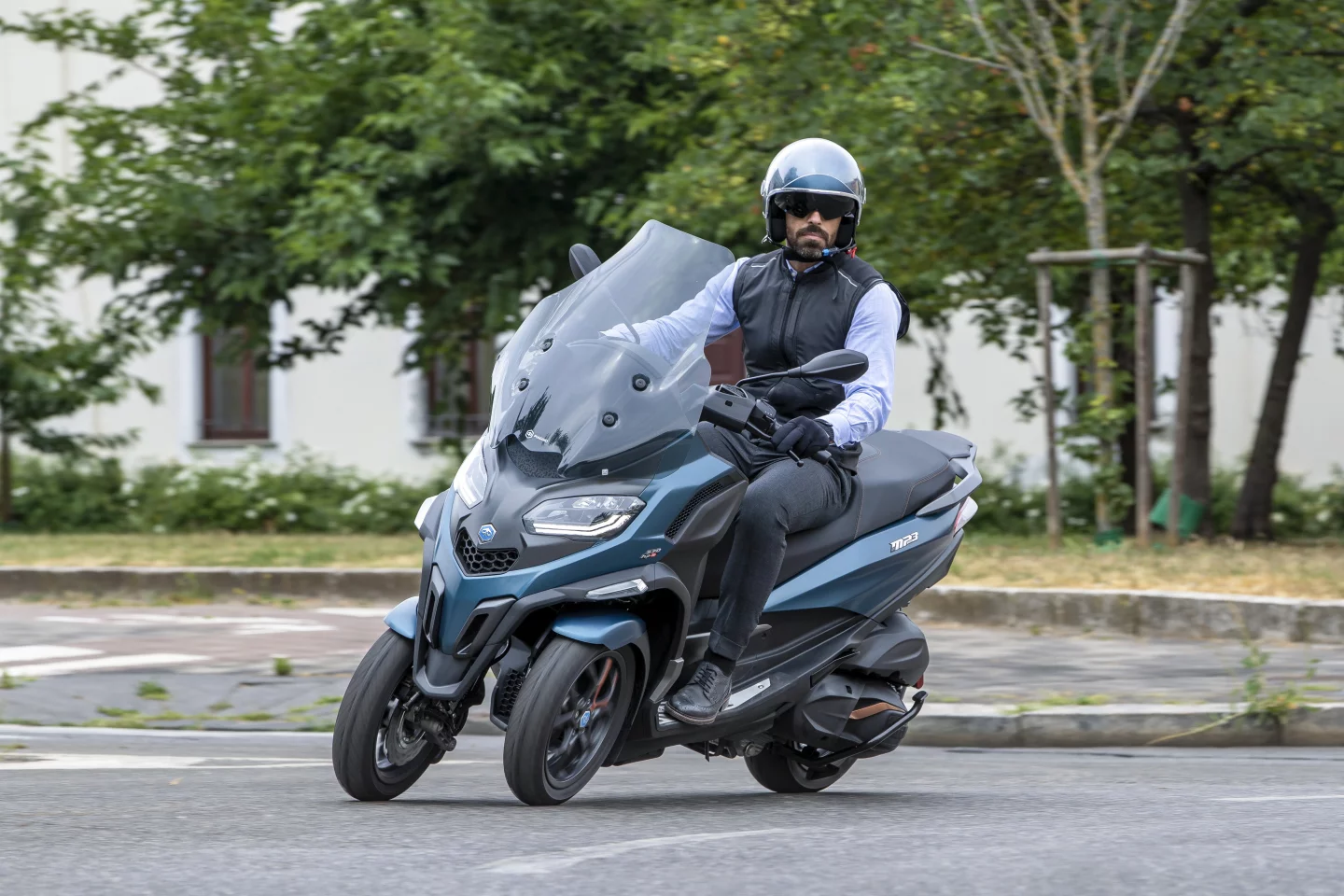 Piaggio's patented front suspension system allows the MP3 to safely lean into corners