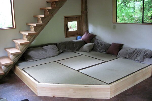 The main living area features a multi-purpose tatami platform, which can be used for eating, relaxing or sleeping