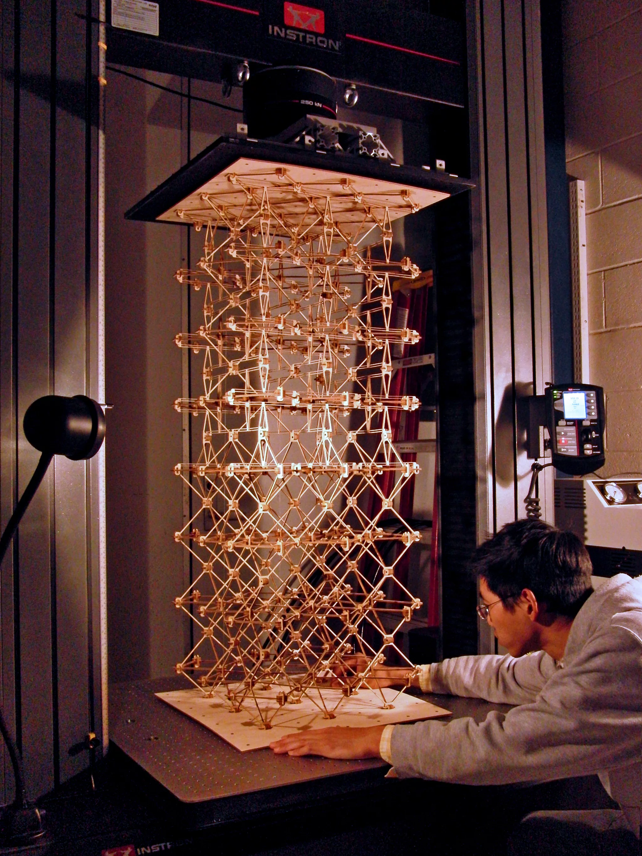 A sample of cellular composite material is set in a load-testing machine to measure mechanical properties such as strength and stiffness(Photo: Kenneth Cheung)