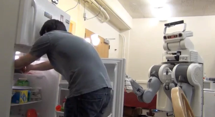 The anticipatory robot helping to open a fridge door