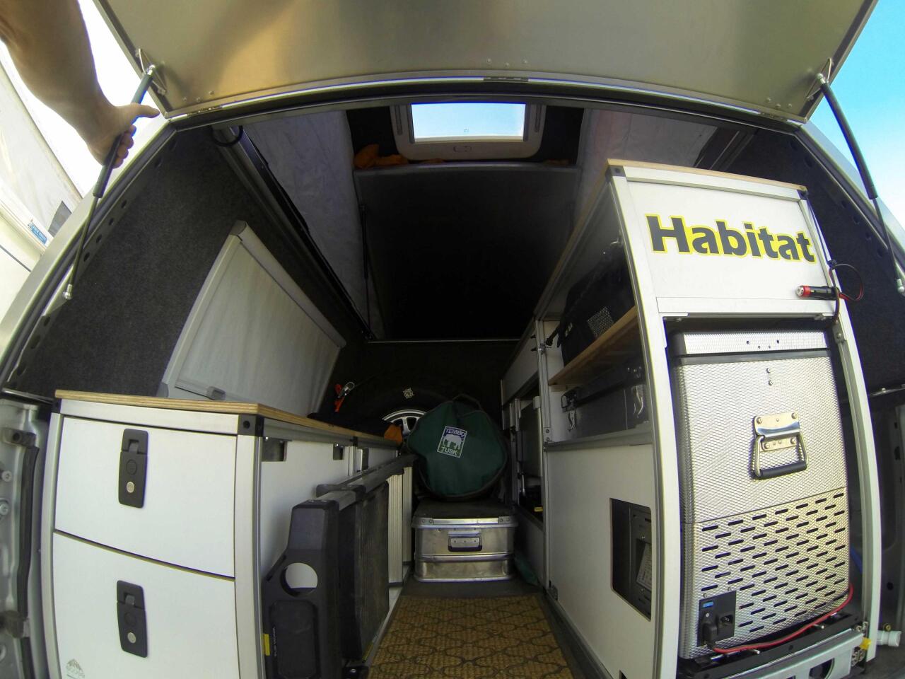 Buyers can leave the interior open for storage or build it up into a more functional camper, as seen in this Tacoma Summit with kitchen gear, storage and more