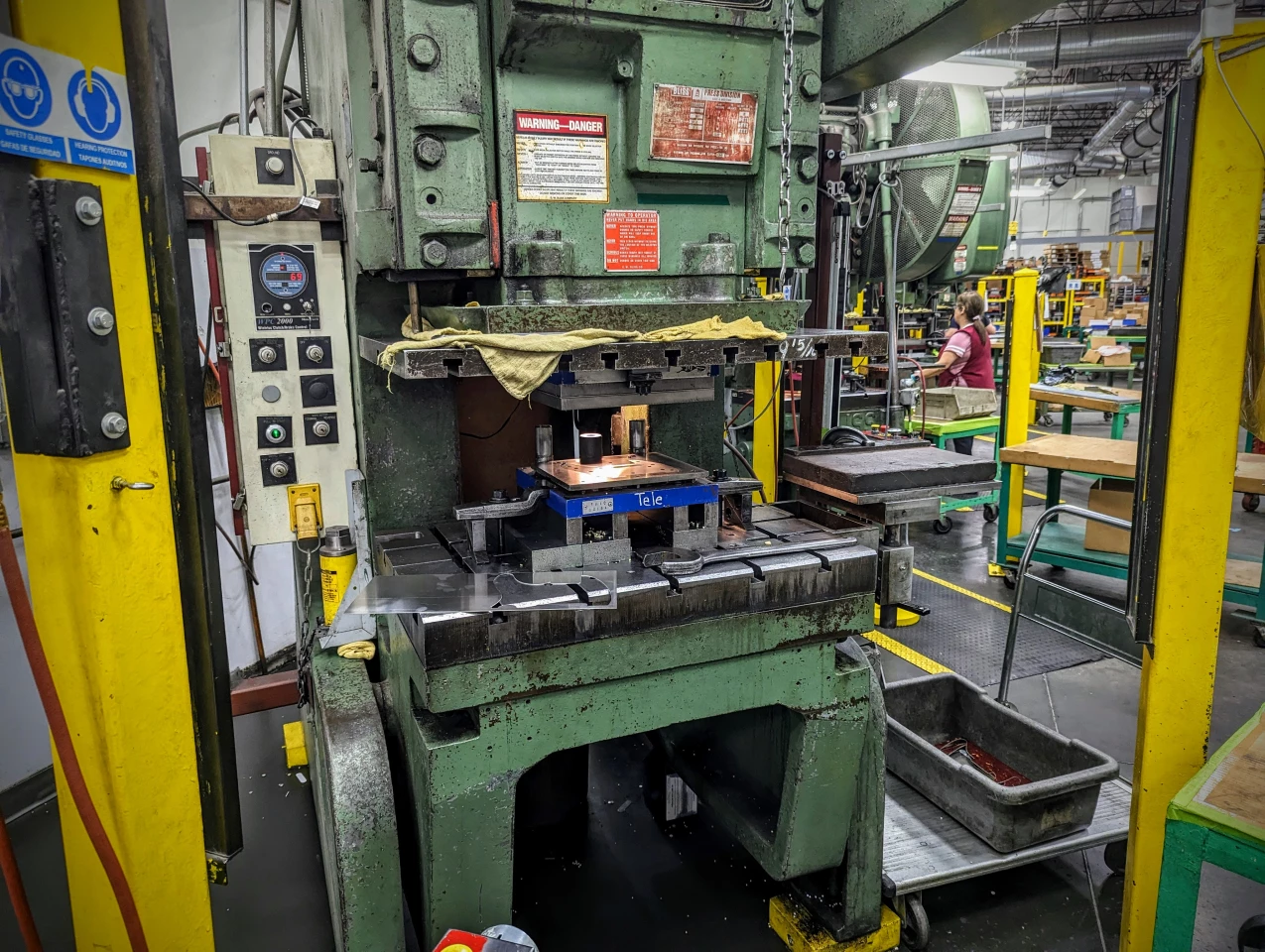 These punch presses have been making Fender parts for longer than anyone's been working at the factory