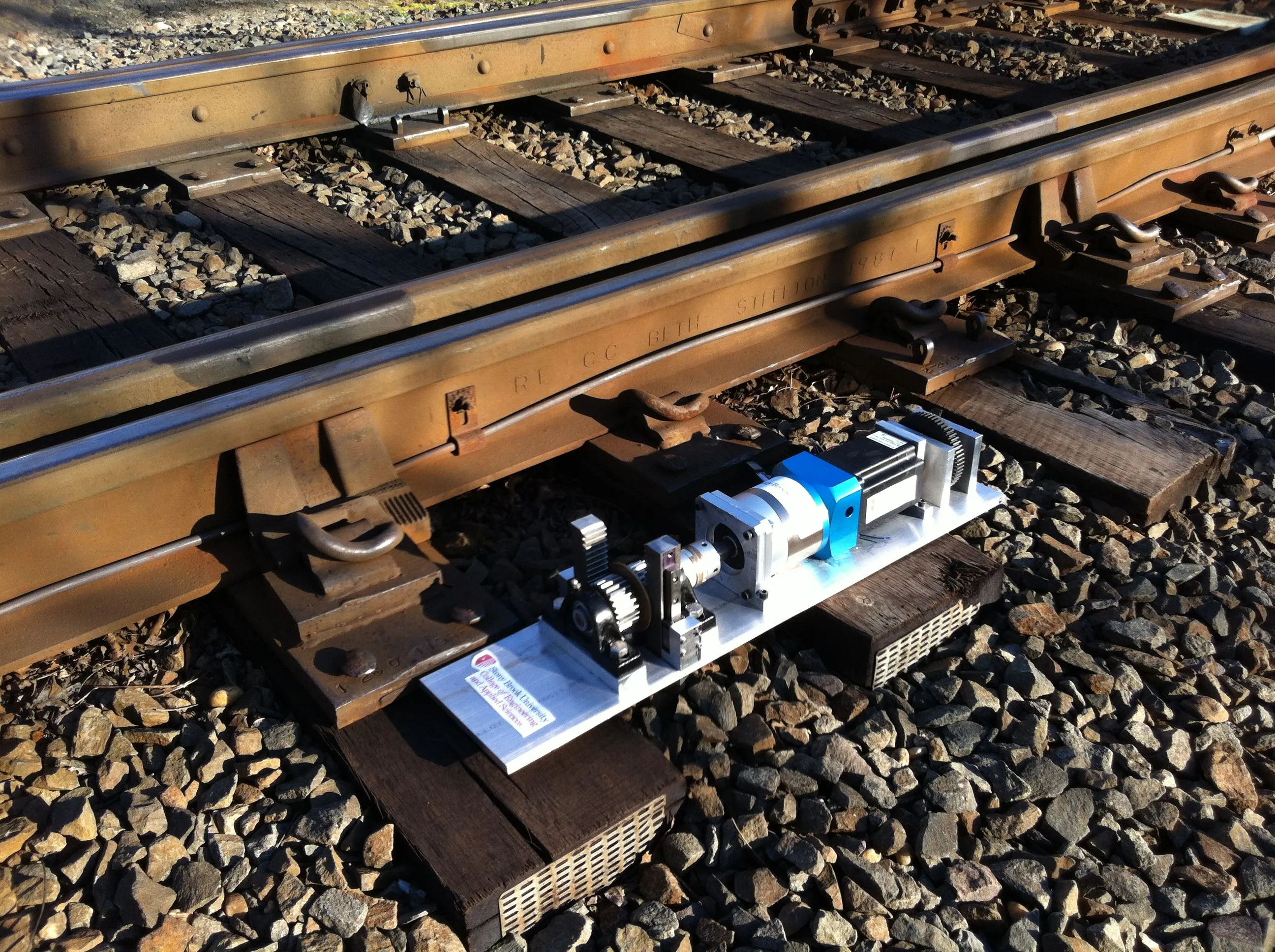 Researchers from Stony Brook University have developed a device capable of harvesting energy from train-induced rail track vibrations to power signal lights, structural monitoring systems or even track switches (Image credit: Lei Zuo)