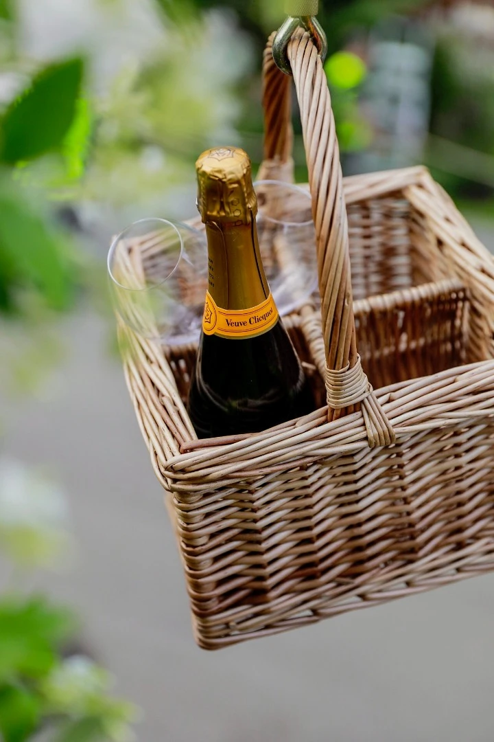 A wicker basket and pulley rope, which hangs on the edge of the deck, can be used for hoisting up treats to the treehouse