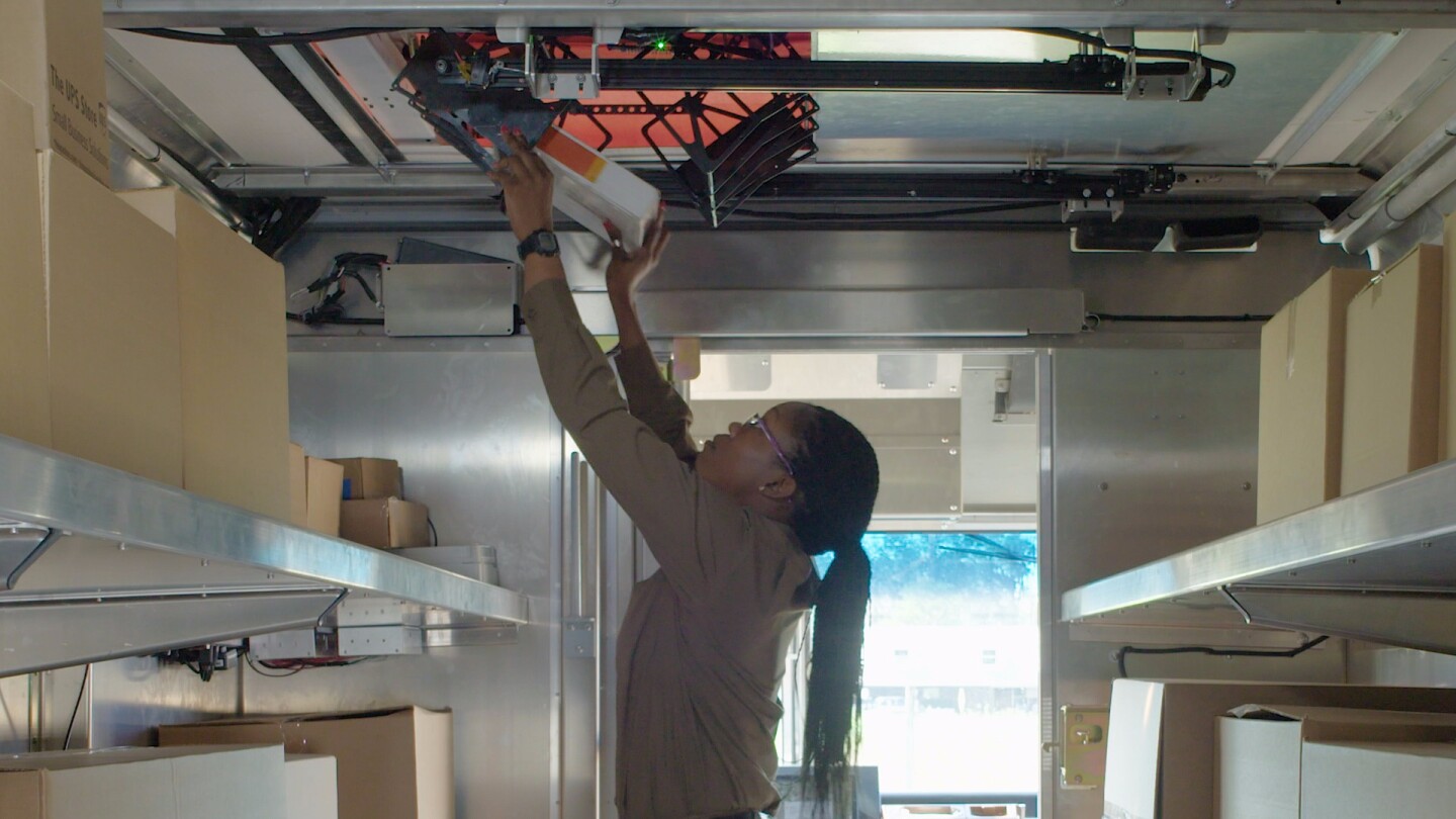 Driver's would load the drone via a cage suspended from the bottom of the drone that extends down into the rear of the truck