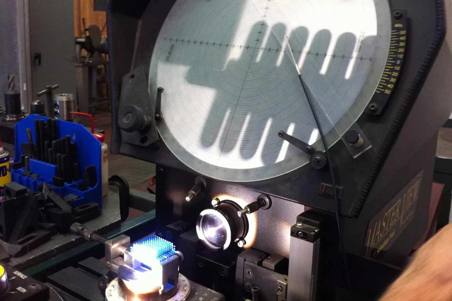 An optical comparator measuring a Bristle Block