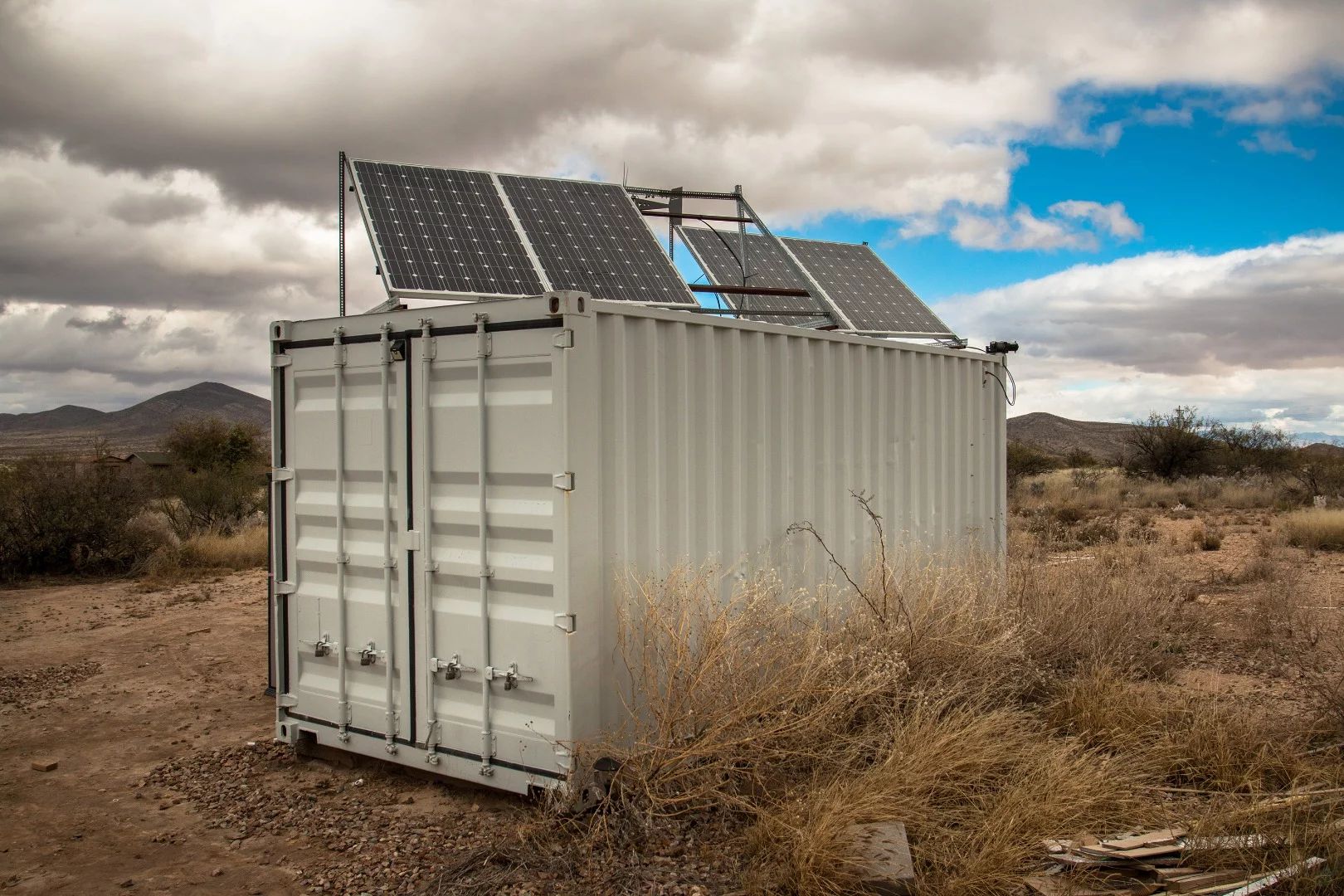 The shipping container serves as Chris' main power junction. His batteries, inverter, converter, and generator are all housed within.