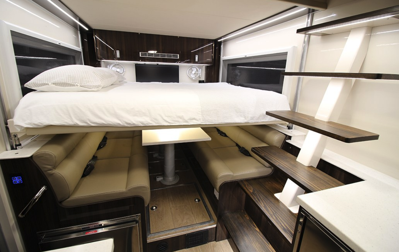 The spare bed drops down to sleep two guests