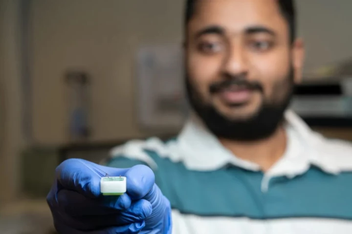 Researcher Shankar Dutt with a new diagnostic tool that can isolate proteins from other biomolecules in the blood to search for signs of early neurodegeneration