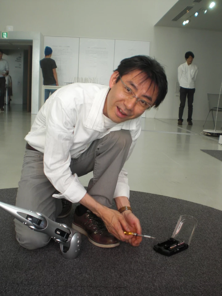 Ichiro Esumi, the creator of Fuhler, making some adjustments to the one-off robot prototype