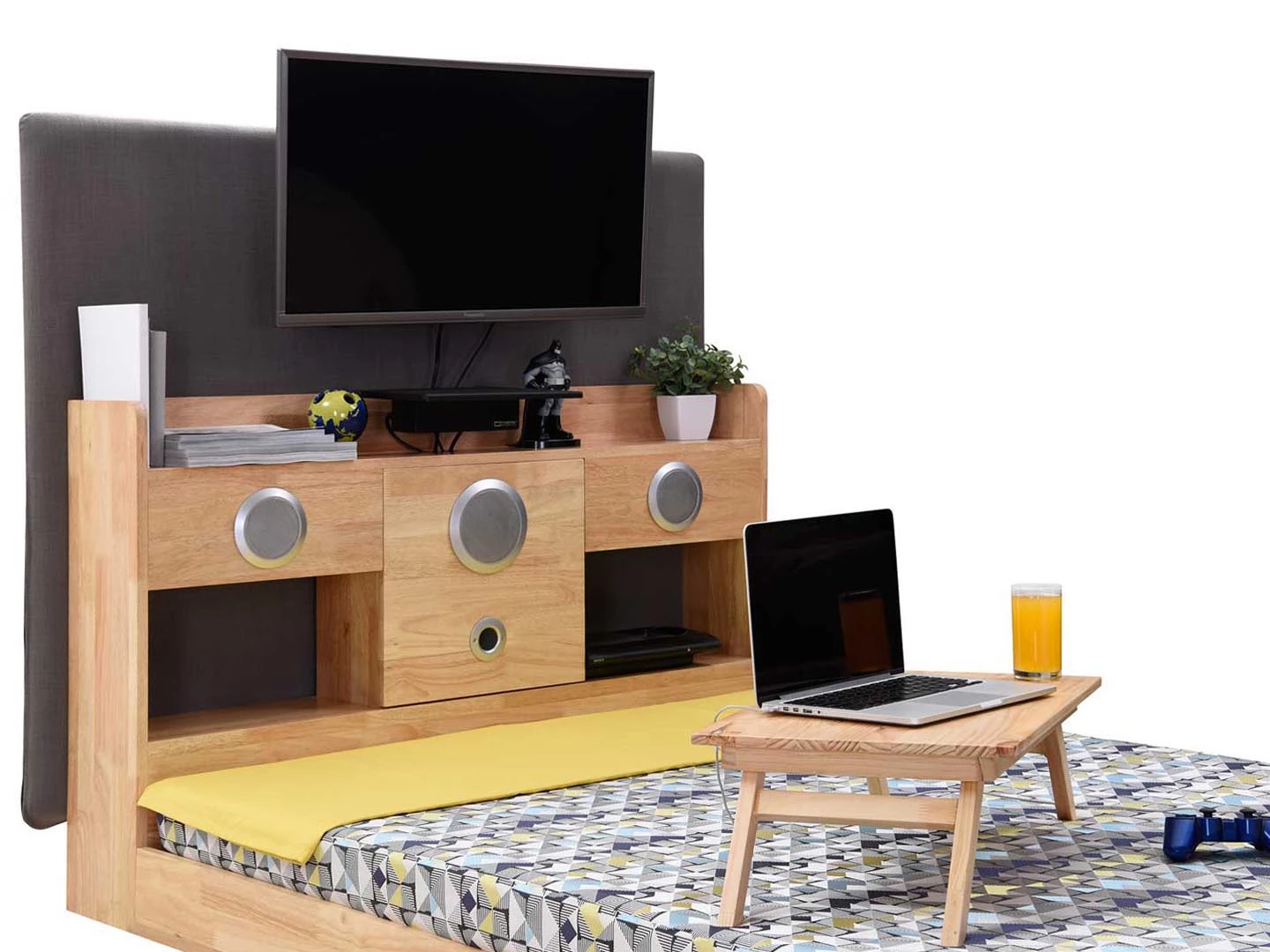 The Pod features a Panasonic 32-inch flat screen LED TV and a bookshelf unit that includes a 2.1 speaker system at the foot of the bed