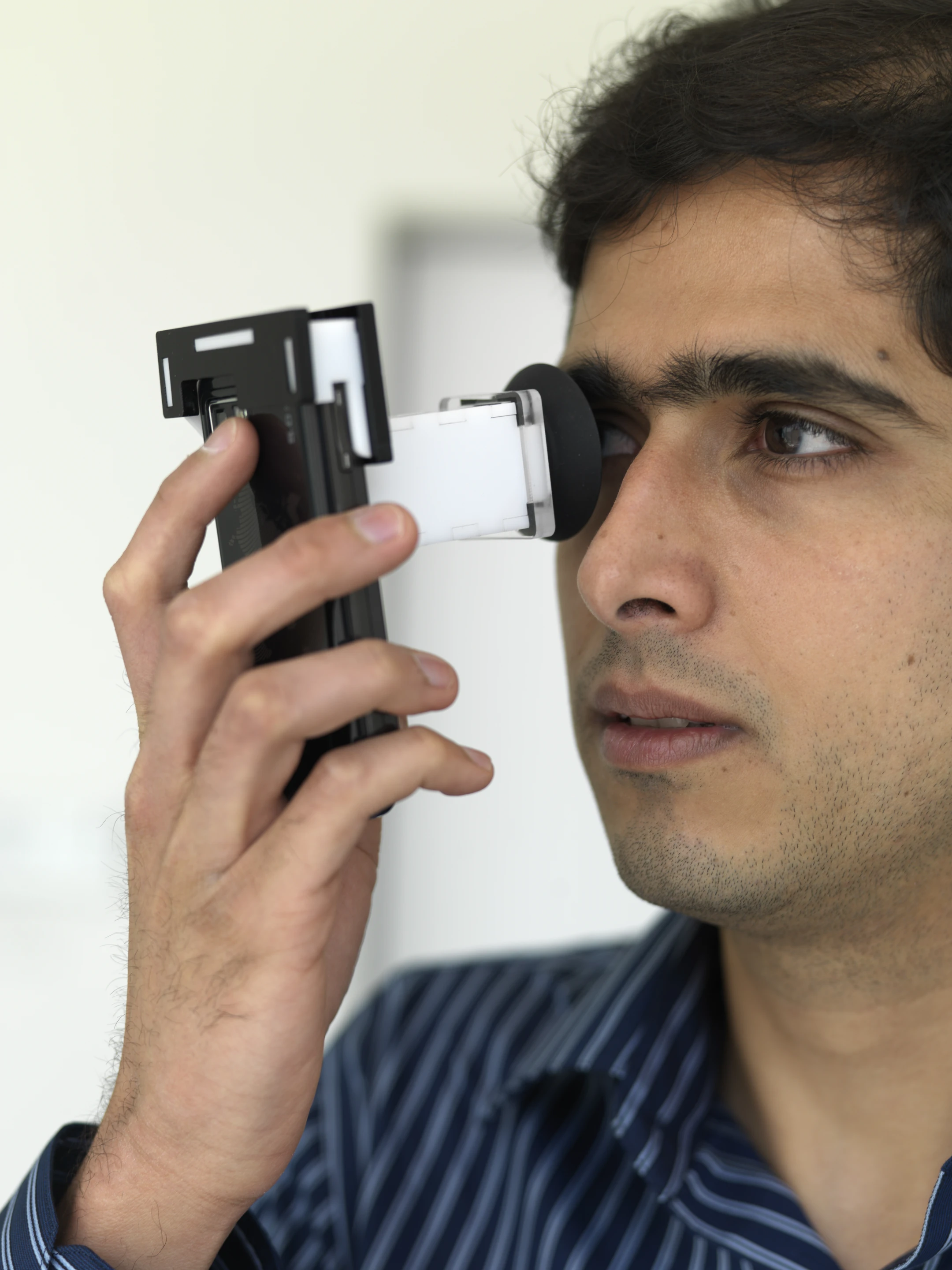 NETRA offers a simple, quick and inexpensive way to use mobile phones to measure refractive errors of the eye (Photo Credit, Andy Ryan)