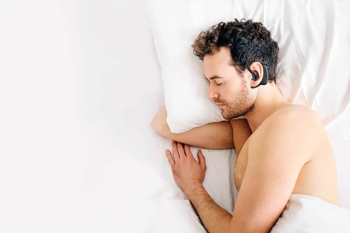 The Snore Circle combats snoring by delivering vibrations behind the ear