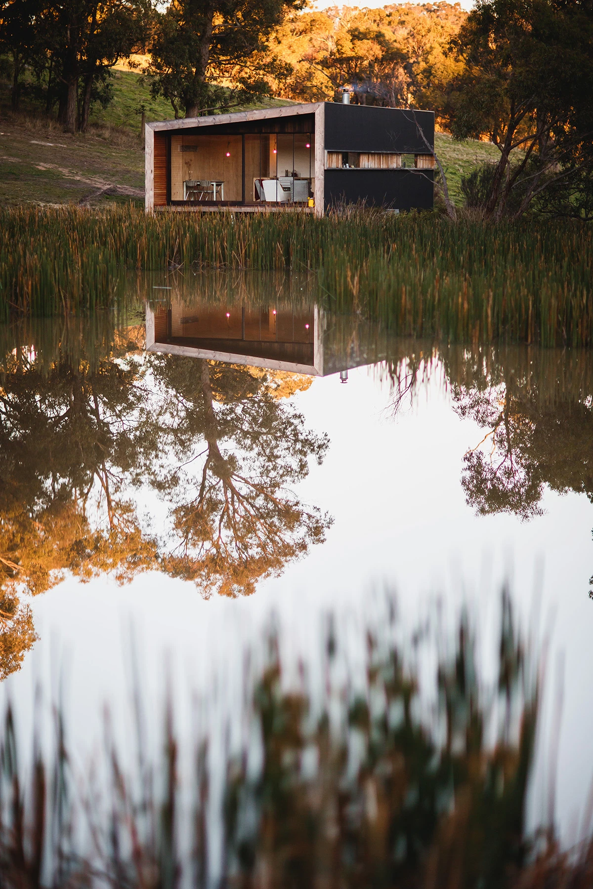 The property is located adjacent to a dam (Photo: Branch Studio Architects)