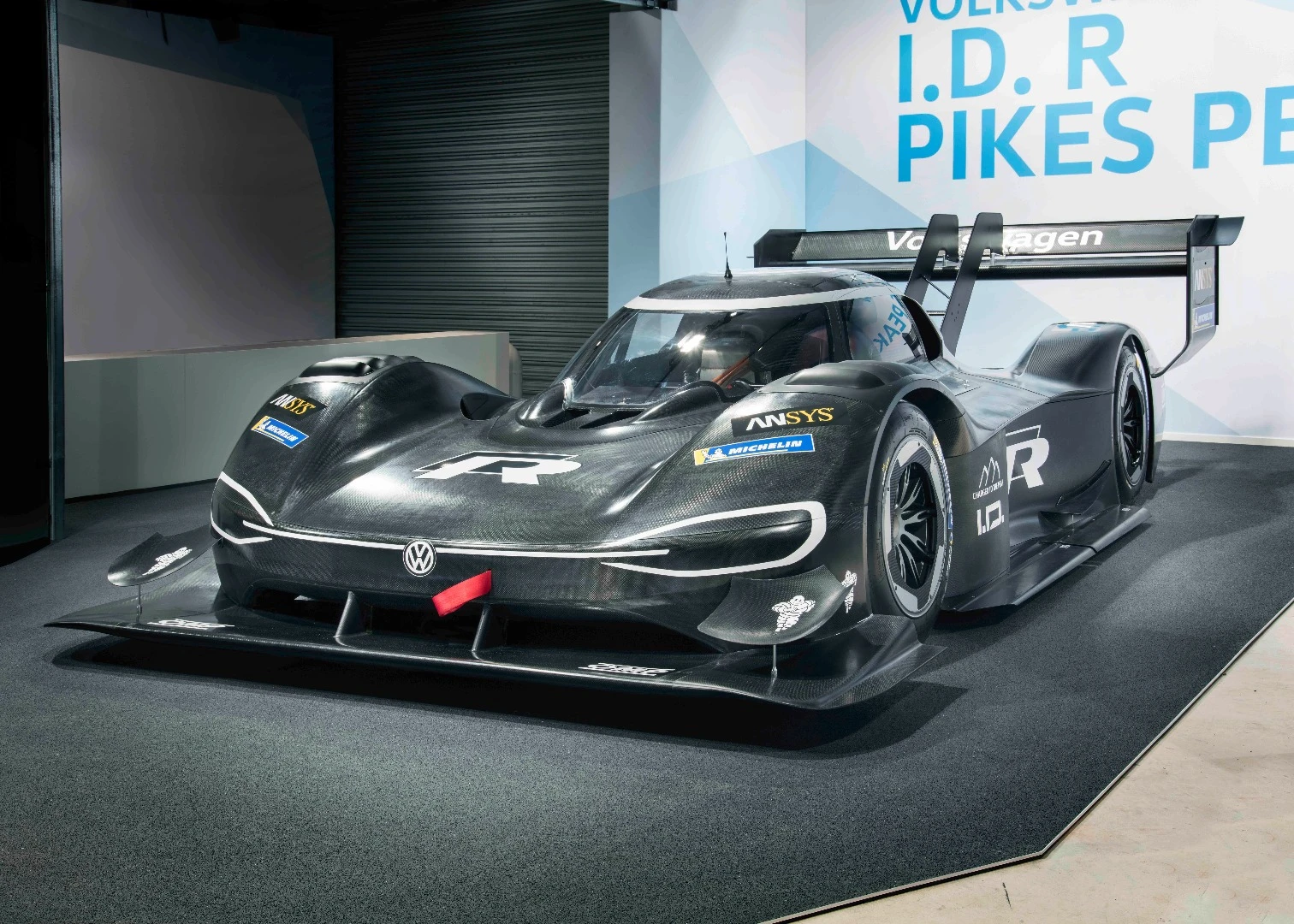 After teasing with series of silhouette peaks and flashy renders, Volkswagen has finally whipped the covers of its first all-electric race car, the I.D. R Pikes Peak