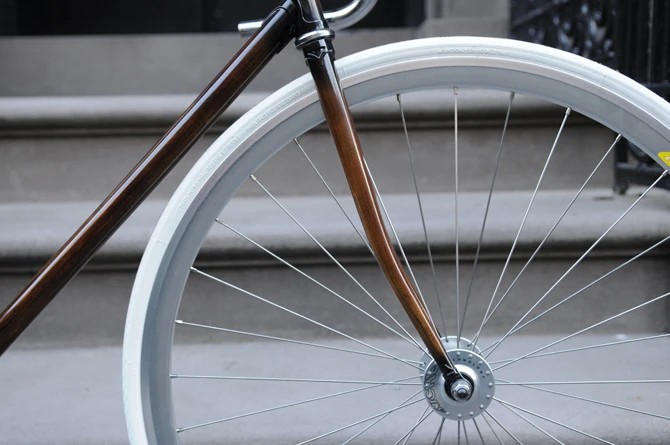 New Zealand's Rob Pollock hand-paints clients' bicycle frames with a faux woodgrain finish