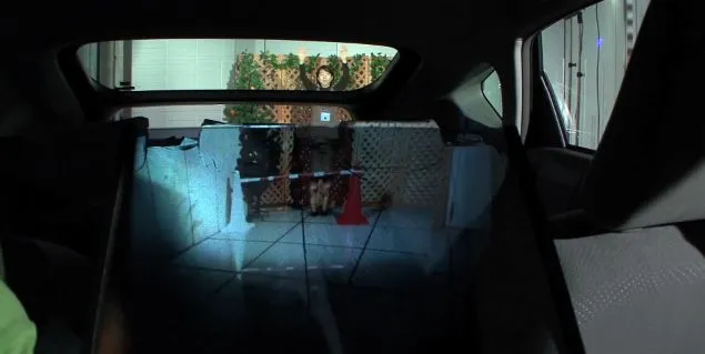 A new in-car rear video system makes the back seat appear transparent, allowing drivers to see more of the road behind them