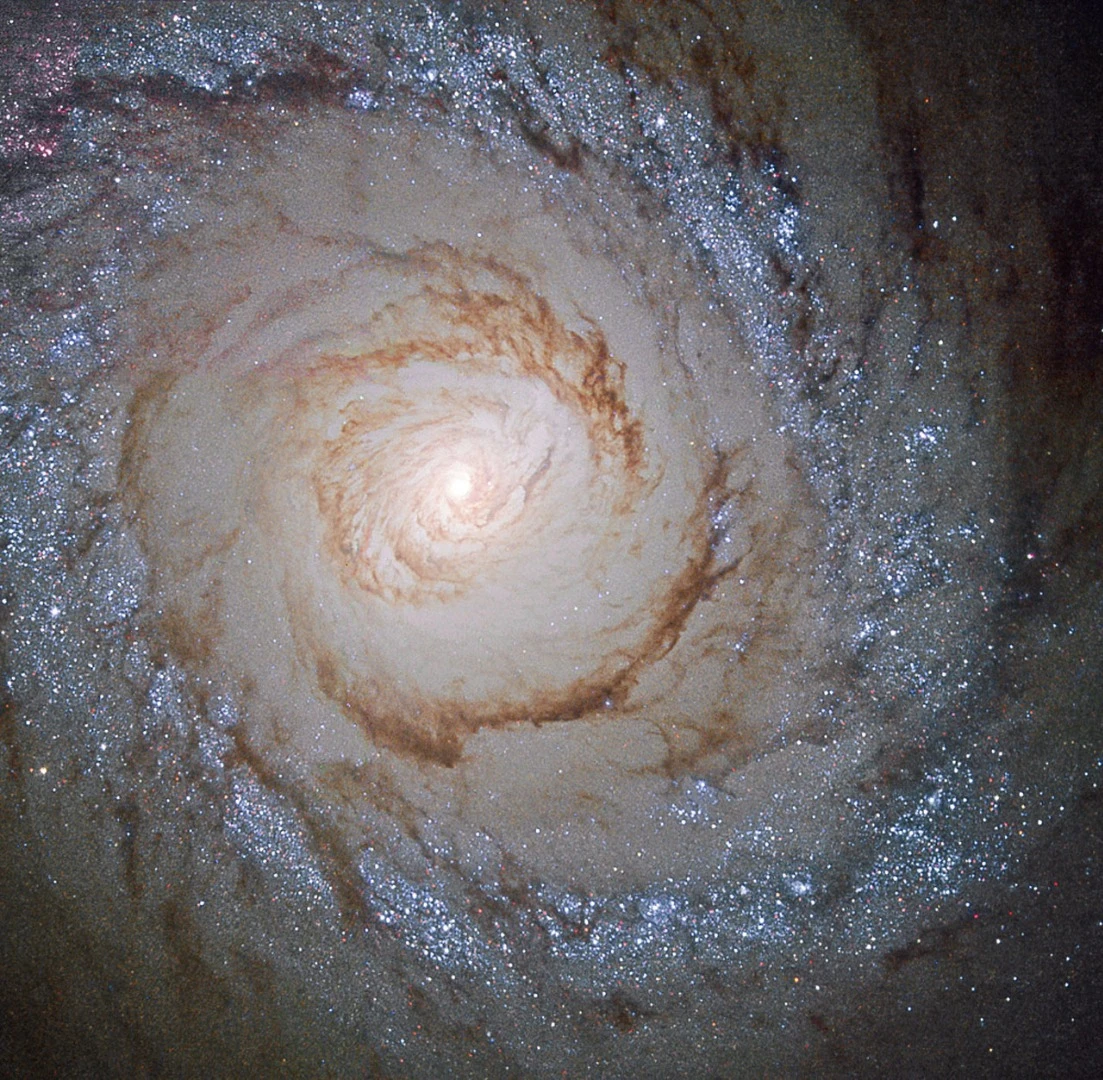 The spiral galaxy M94 is located 16 million light-years away in the direction of the constellation Canes Venatici